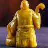Резная фигурка «Монах с посохом» из натурального янтаря для интерьера дома